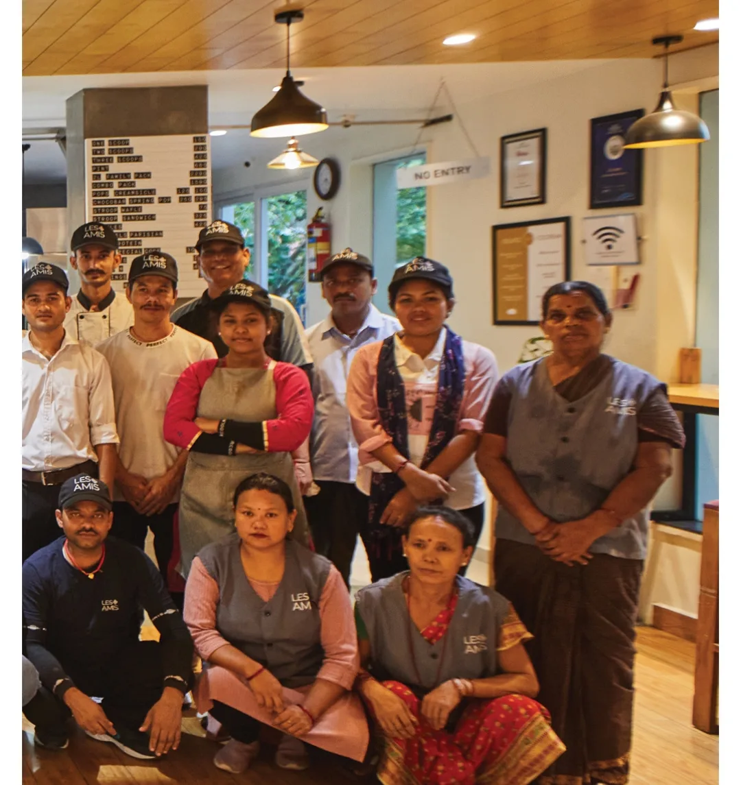 The full Les Amis team gathered in the café